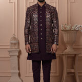 Men’s plum brocade Indo-Western with metallic embroidery and antique buttons.