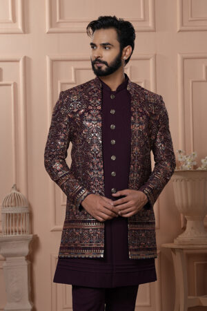 Men’s plum brocade Indo-Western with metallic embroidery and antique buttons.