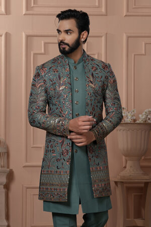 Men’s teal green embroidered Indo-Western jacket set with floral motifs and sequins.