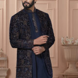 Men’s navy blue Indo-Western jacket set with golden zari embroidery.