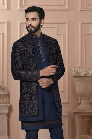 Men’s navy blue Indo-Western jacket set with golden zari embroidery.