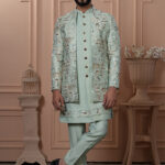 Men’s pastel green Indo-Western with embroidered royal motifs and detailed embellishments.