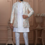 Men’s ivory white Indo-Western outfit with pastel floral embroidered jacket.
