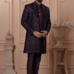 Men’s royal plum Indo-Western outfit with embroidered jacket featuring geometric patterns.