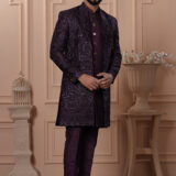 Men’s royal plum Indo-Western outfit with embroidered jacket featuring geometric patterns.