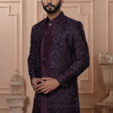 Men’s royal plum Indo-Western outfit with embroidered jacket featuring geometric patterns.