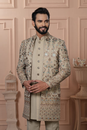 Men’s beige Indo-Western outfit with floral embroidery and mirror work jacket.