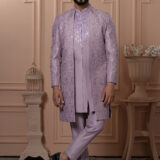 Men’s lavender Indo-Western outfit with mirror work and embroidered jacket.