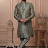 Men’s pastel green Indo-Western with embroidered jacket, matching kurta, and pants.
