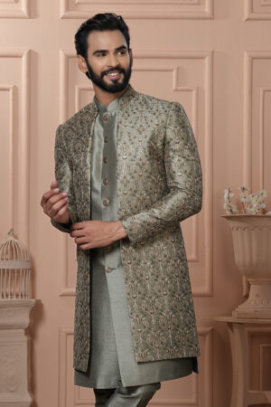 Men’s pastel green Indo-Western with embroidered jacket, matching kurta, and pants.