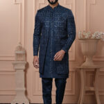 Men’s navy blue embroidered Indo-Western with front-open jacket, kurta, and pants.