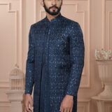 Men’s navy blue embroidered Indo-Western with front-open jacket, kurta, and pants.