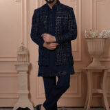 Men’s navy blue velvet Indo-Western with embroidered jacket, paired with matching kurta and trousers.