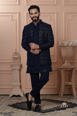 Men’s navy blue velvet Indo-Western with embroidered jacket, paired with matching kurta and trousers.
