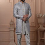 Men’s silver-grey Indo-Western with embroidered jacket, paired with matching kurta and trousers.