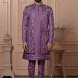 Men’s lavender Indo-Western with embroidered and mirror work jacket, paired with kurta and trousers.