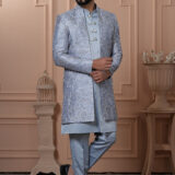Men’s powder blue Indo-Western outfit with embroidered jacket and metallic-buttoned kurta.