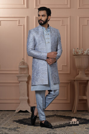 Men’s powder blue Indo-Western outfit with embroidered jacket and metallic-buttoned kurta.