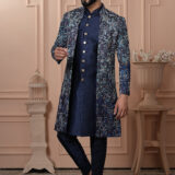 Men’s navy blue Indo-Western outfit with floral embroidered jacket and metallic button kurta.