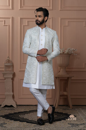 Men’s ivory white Indo-Western outfit with embroidered jacket and golden button kurta.