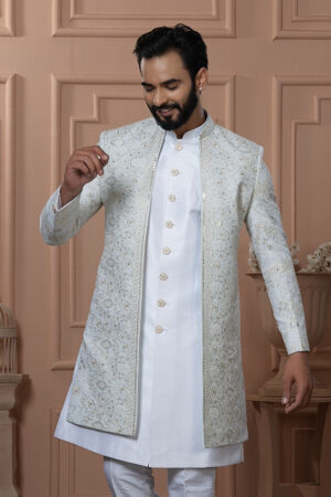 Men’s ivory white Indo-Western outfit with embroidered jacket and golden button kurta.