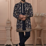 Men’s black Indo-Western outfit with heritage-style embroidery of elephants, deer, and floral motifs.