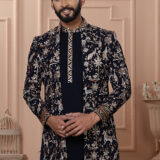 Men’s black Indo-Western outfit with heritage-style embroidery of elephants, deer, and floral motifs.