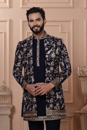 Men’s black Indo-Western outfit with heritage-style embroidery of elephants, deer, and floral motifs.