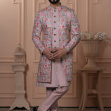 Men’s pastel pink Indo-Western outfit with multicolor embroidered jacket and matching kurta set.