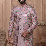 Men’s pastel pink Indo-Western outfit with multicolor embroidered jacket and matching kurta set.