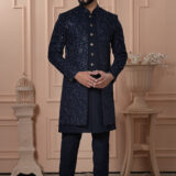 Men’s navy blue Indo-Western outfit with embroidered jacket and matching kurta set.