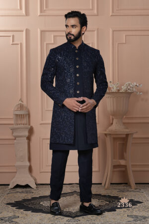 Men’s navy blue Indo-Western outfit with embroidered jacket and matching kurta set.