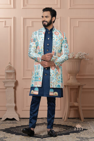 Men’s ivory Indo-Western jacket with multicolor geometric prints paired with a royal blue kurta set.