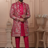 Man wearing a red embroidered Indo-Western with golden detailing.