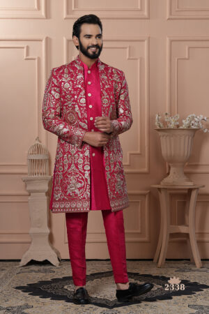 Man wearing a red embroidered Indo-Western with golden detailing.