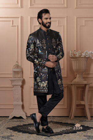 Man wearing a black embroidered Indo-Western with royal motifs and camel designs.