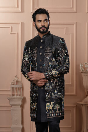 Man wearing a black embroidered Indo-Western with royal motifs and camel designs.
