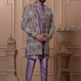Man wearing a lavender Indo-Western outfit with intricately embroidered long jacket.