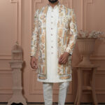 Man wearing cream Indo-Western outfit with pastel embroidered long jacket.