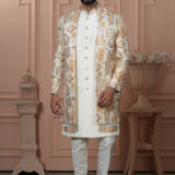 Man wearing cream Indo-Western outfit with pastel embroidered long jacket.