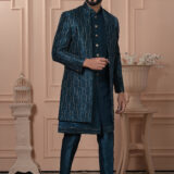 Man wearing teal Indo-Western outfit with a textured embroidered long jacket.