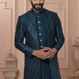 Man wearing teal Indo-Western outfit with textured embroidered long jacket.