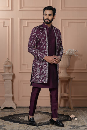 Man wearing plum Indo-Western outfit with a silver-thread-embroidered long jacket.