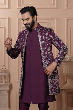 Man wearing plum Indo-Western outfit with silver thread embroidered long jacket.