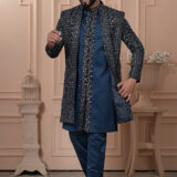 Man wearing navy Indo-Western outfit with all-over embroidered long jacket.