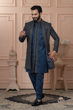 Man wearing navy Indo-Western outfit with all-over embroidered long jacket.