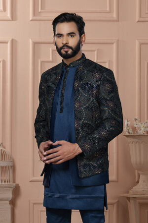 Man wearing navy Indo-Western with embroidered geometric patterned jacket.