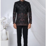 Black Jodhpuri suit with multicolor embroidery featuring peacock and elephant motifs.