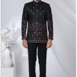 Black Jodhpuri suit with multicolor embroidery featuring peacock and elephant motifs.