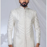 White Jodhpuri suit with silver geometric and floral embroidery.